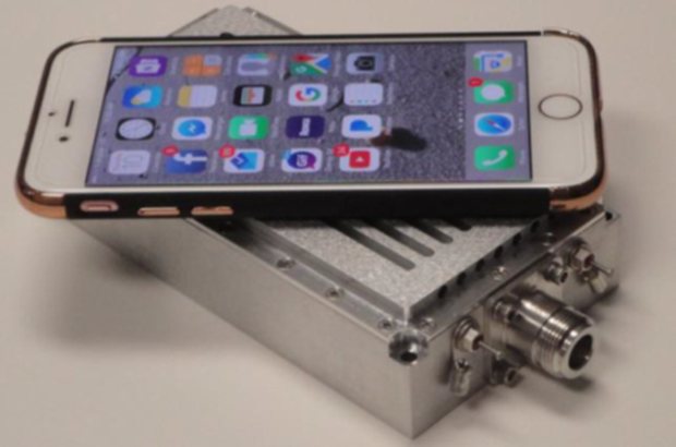 One kilowatt UHF amplifier with a smartphone resting on its lid for scale