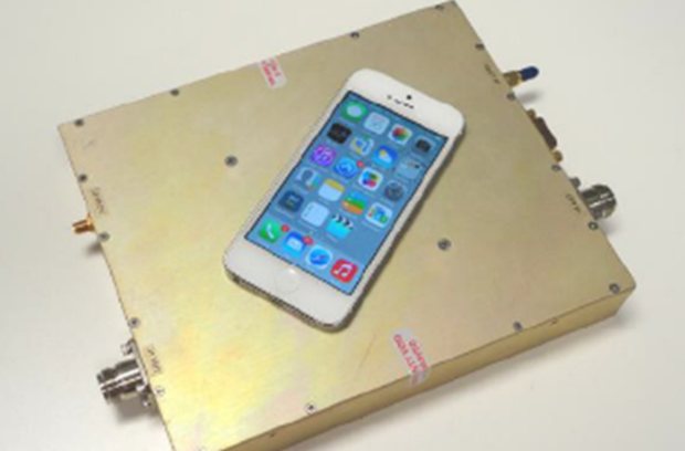 One kilowatt high-power solid-state transmit and receive module with a smartphone on it for scale